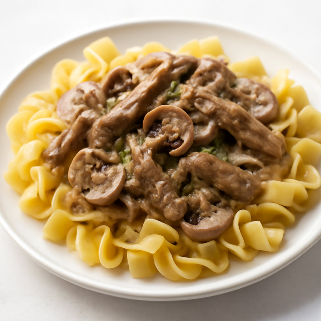 Beef Stroganoff - classic tender beef strips in a creamy mushroom sauce over egg noodles recipe created by pantribot using RolTak AI