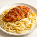 Chicken Alfredo - classic creamy parmesan alfredo sauce with fettuccine and pan-seared chicken recipe created by pantribot using RolTak AI
